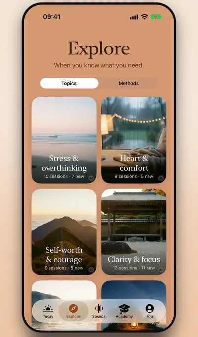 Screenshot: the Explore tab with themes such as Stress & overthinking, Heart & comfort and Clarity & focus