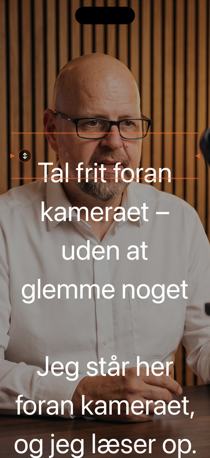iPhone-prompter med dansk tekst over et kamerabillede
